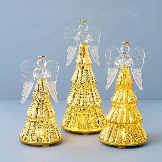 Ensemble de 3 figurines d'anges illuminées par une lumière radieuse