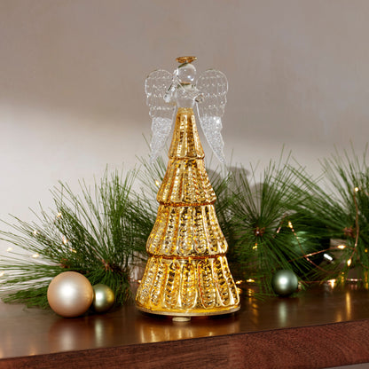 Figurine d'ange illuminée par une lumière rayonnante