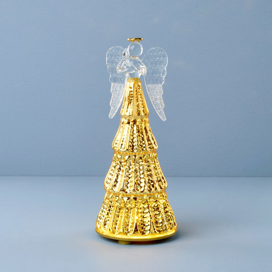 Figurine d'ange illuminée par une lumière rayonnante