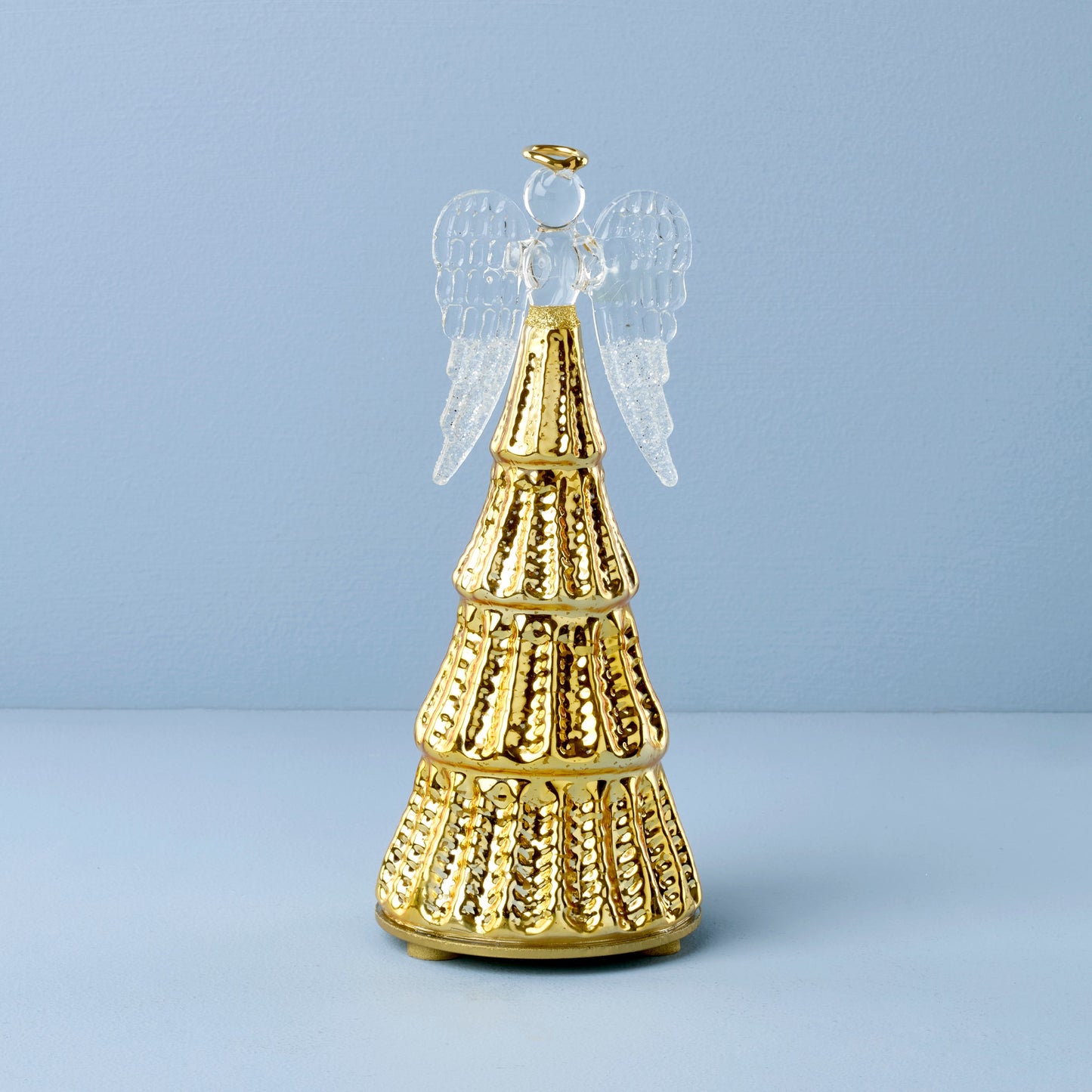 Figurine d'ange illuminée par une lumière rayonnante